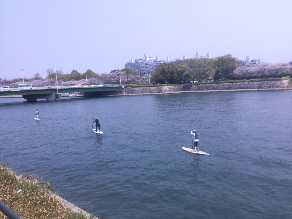 eat pray greg paddle boarding in hiroshima